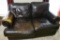 Leather Love seat with a little wear on the seat and arm rest, Solid love seat and very comfortable
