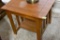 Wooden end table with a small shelf on the bottom. Must bring help to load.