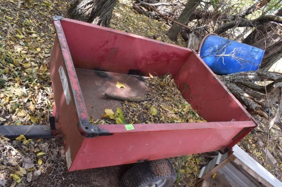 Pull behind small metal wagon with dump