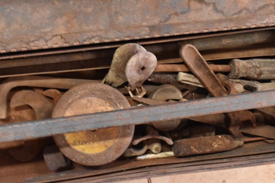 Metal tool box with a few hand tools inside