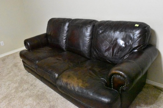 Leather couch with a little wear on one of the cushions.... Solid couch. Must bring help to load.