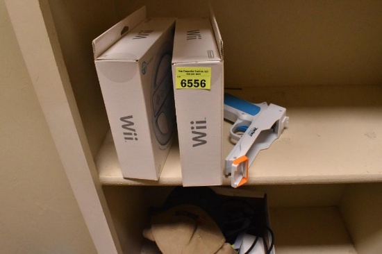 2 new wii wheels and a wii pistol attachment