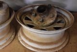 2 vehicle rims and axle hubs