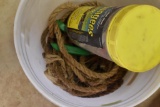 Bucket with rope and bungees