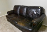 Leather couch with a little wear on one of the cushions.... Solid couch. Must bring help to load.