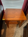 Wooden end table with a small shelf on the bottom. Must bring help to load.