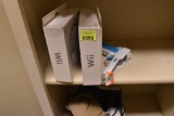 2 new wii wheels and a wii pistol attachment