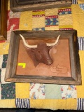 Hand embossed leather bull