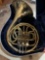 French horn in case