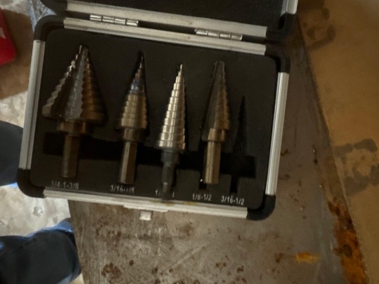 Step drill bits