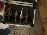 Step drill bits