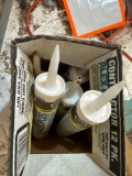 Containers of caulk...
