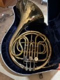French horn in case