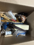 Box of kitchen gadgets and a football
