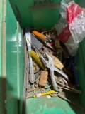 Various garage items in bin