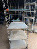 Metal shelf on wheels...Must bring help to load