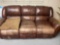 leather couch with recliners on both sides