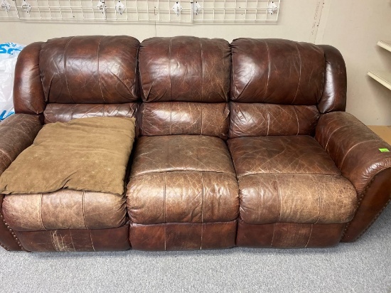 leather couch with recliners on both sides