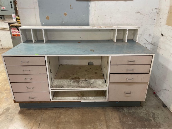 front desk counter with drawers and shelves