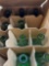 Dozen wine bottles, four brown eight green