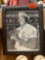 Baseballs in a frame picture of a baseball player