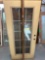 Glass door with wooden frame around it 36 x 79 1/4 in...
