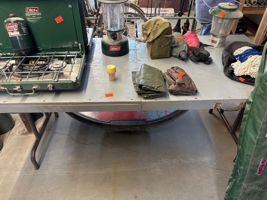 Table made out of wood and handled a few pulled up, buckle together and carry