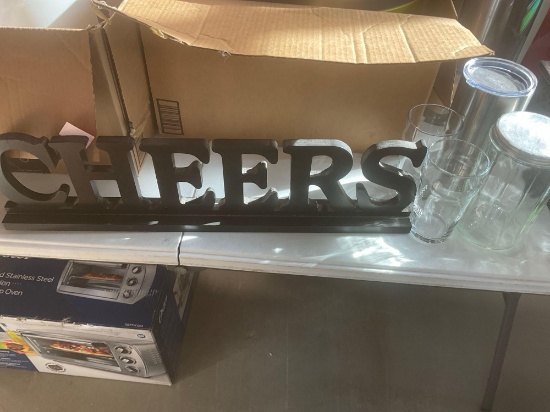 Cheer sign, and drinking glasses