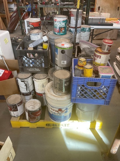 Pallet of paint foam brushes and stains