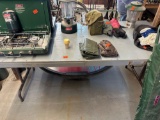 Table made out of wood and handled a few pulled up, buckle together and carry