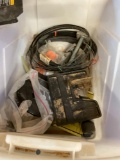 Tote full of various items tool parts, bandsaw blades miter saw plastic parts no saw