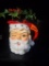 Ceramic Santa pitcher with floral arrangement