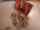 small insulators in an old coffee can