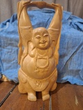 Wooden carving of Budai- or laughing buddha.