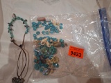Broken jewelry pieces and a necklace