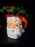 Ceramic Santa pitcher with floral arrangement