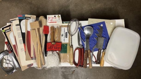 Kitchen utensils in plastic box and containers