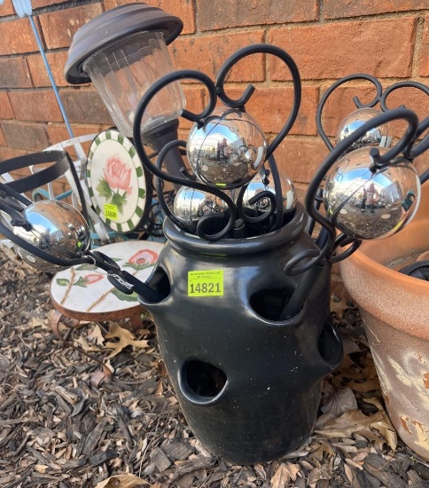 Clay pot and multiple yard stakes