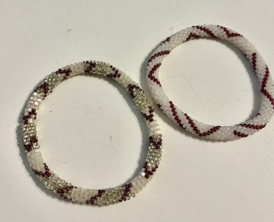 2 white beaded bracelets