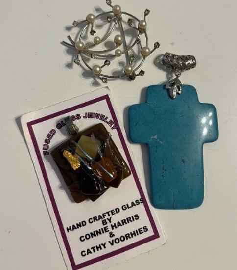 2 pendants and a pin