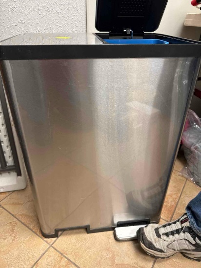 Metal container with foot pedal to open door