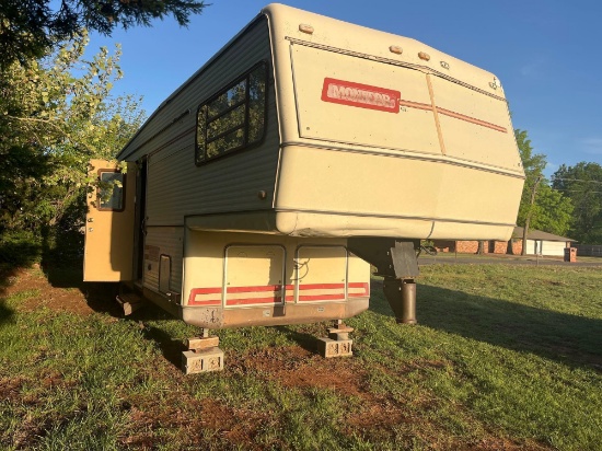 A- 1985 fifth wheel travel trailer