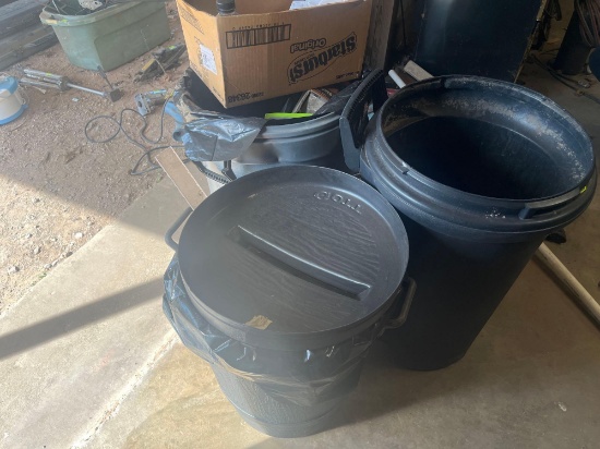 Large black trash cans