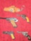 4 Assorted, Vintage , Small Cap Guns and Key Chains. Plus 1 Keychain Holster. All one Money.