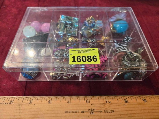Jewelry Organizer with Assorted Earring Sets, Pendants, and Other.
