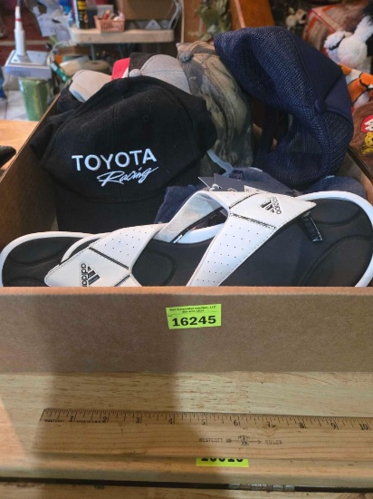 Box of Assorted Caps, New Scarf, and Adidas Flip-Flops Size 8. All one Money.