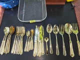 30 Piece Set of Ornate, Gold Toned Flatware and Serving Utensils.