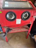 Sandblasting cabinet.