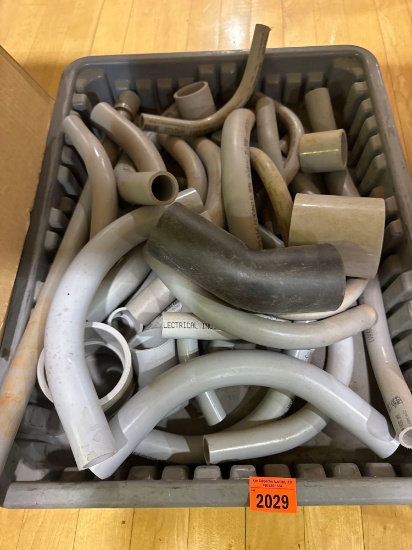 Tote with various PVC pieces and fittings
