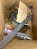 Box with plumbers strap, silicone, staples, nails, metal file and much more